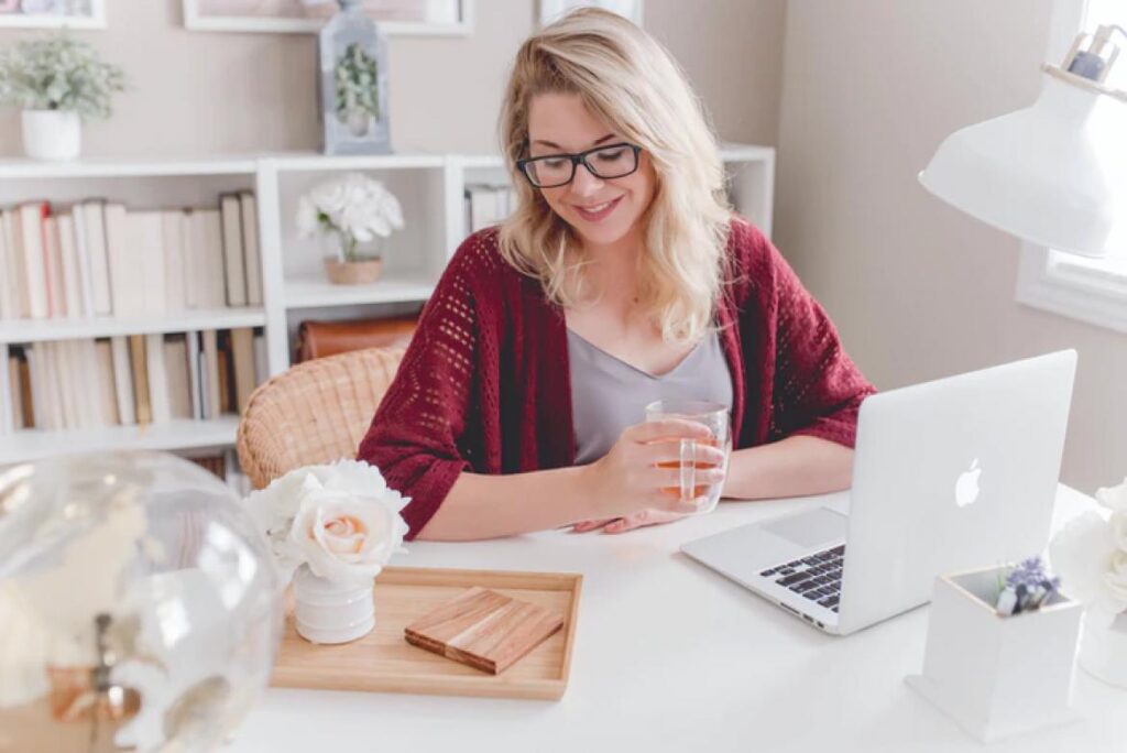 woman sitting at desk with laptop