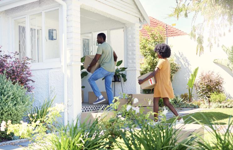 young couple moving in to house