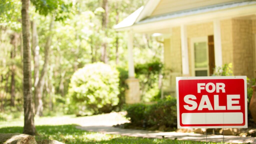 house with for sale sign outside