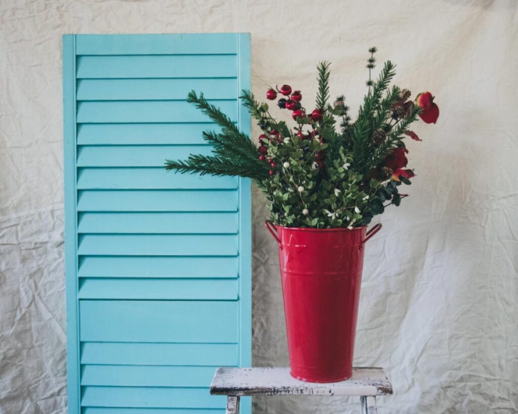 vase with flower plant on shelf