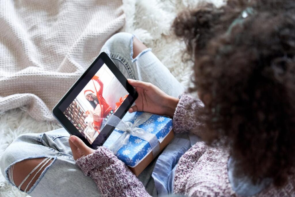 woman on video call with someone on tablet