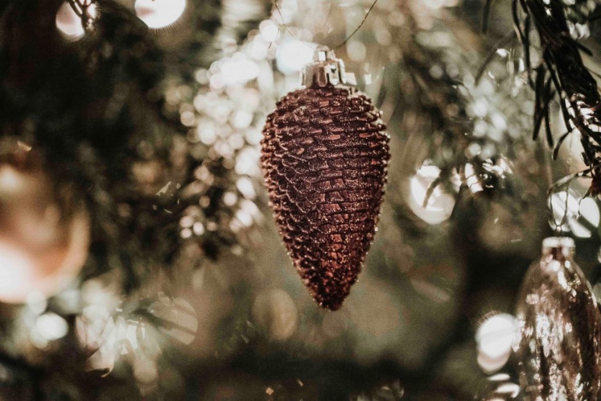 pinecone ornament hanging from Christmas tree